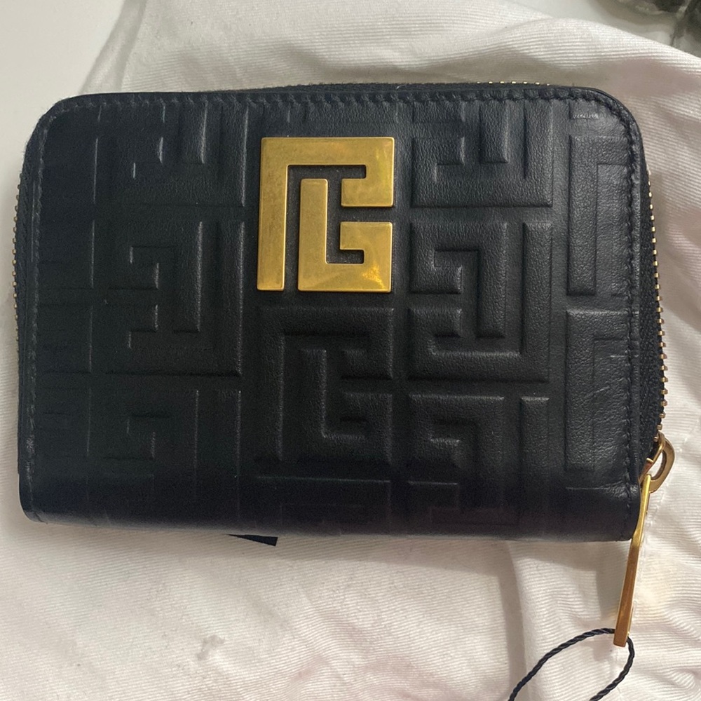 Balmain
Monogram-pattern zipped wallet